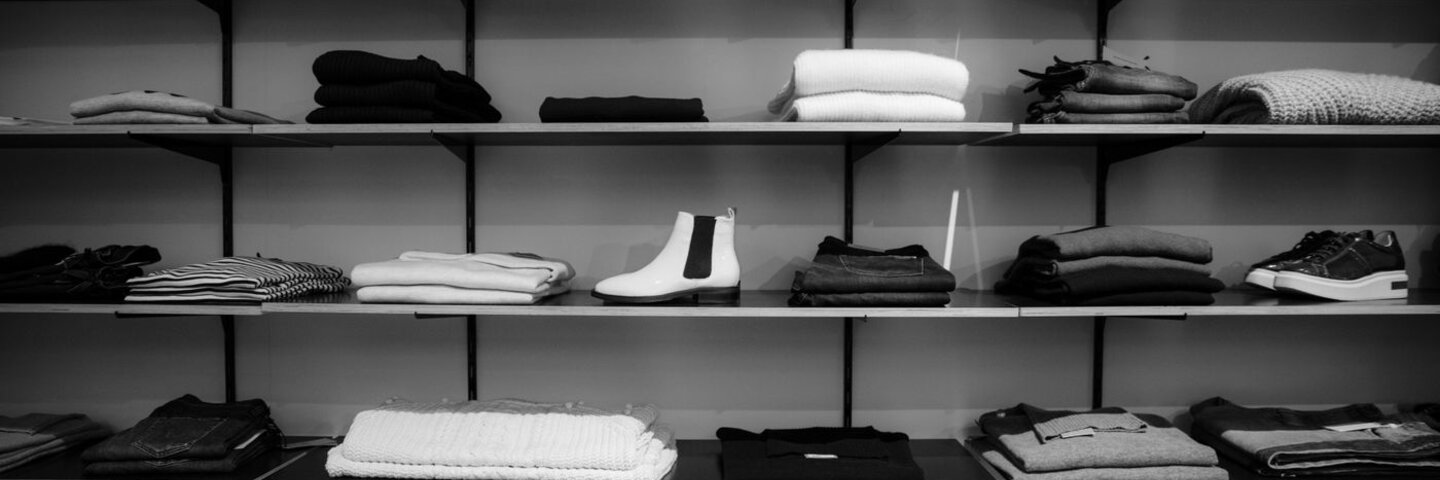Folded clothing on retail store shelves