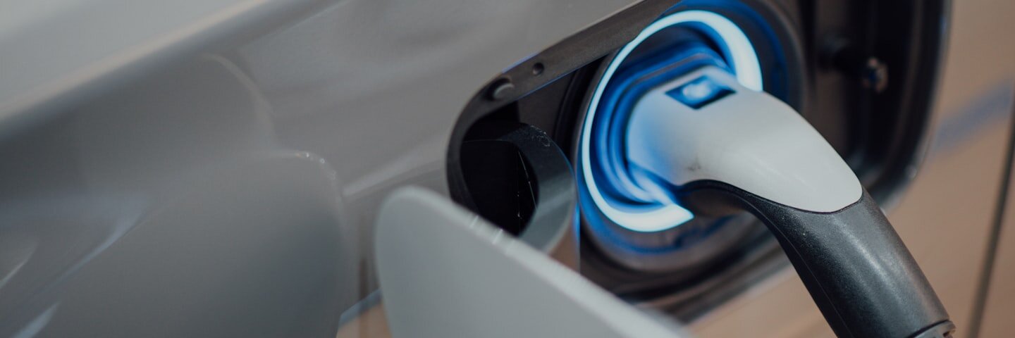Electric-vehicle charging cable plugged into a car